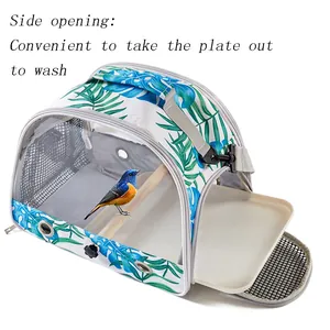 Detailed view of portable bird carrier bag featuring a side opening for easy tray cleaning