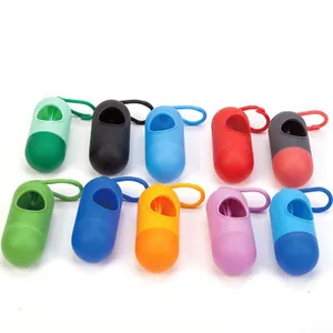 Bullet-shaped dog waste bag dispensers in multiple vibrant colors with hanging hooks