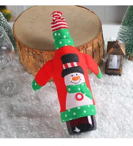 Christmas snowman wine bottle cover decoration on festive snow background