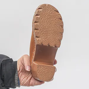Detailed view of brown clog sole featuring anti-slip texture and size 37 mark