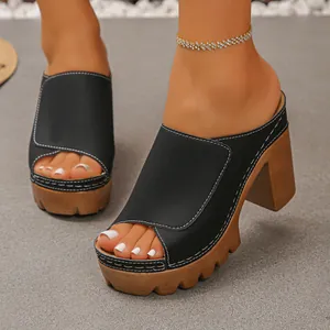 Close-up detail of retro peep-toe platform sandals with white contrast stitching