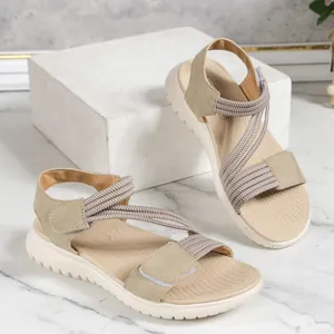 Comfortable women's beige platform sandals with elastic straps and velcro closure