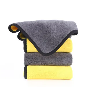 High-absorbency grey and yellow microfiber pet bath towels stacked on a white background