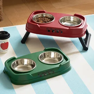 Elevated double stainless steel pet bowls with foldable legs in red and green colors