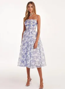 Full-length view of white floral chiffon evening dress featuring elegant flared skirt