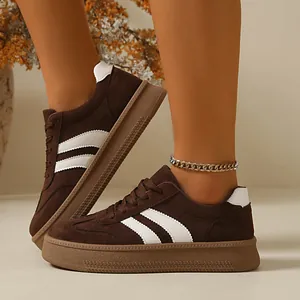 Close-up of retro brown suede German Trainer shoes with thick gum soles