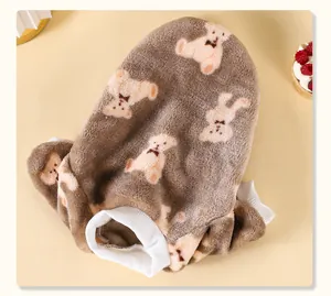 Close-up showing the soft flannel texture and cute teddy bear patterns on this pet sweater