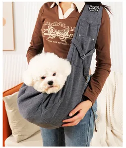 Soft gray cotton pet sling carrier for small dogs and cats shown in a home setting