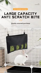 Large capacity black hay feeding bag for rabbits inside a cage with holes for easy access.