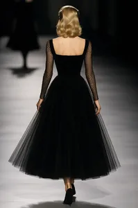 Vintage French black tulle maxi dress with mesh sleeves, square neckline and full skirt.