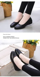 Detail view of black soft leather flat shoes with round toe and wedge heel design
