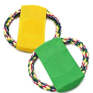 Detail of durable yellow and green canvas dog frisbee toys with colorful rope rings