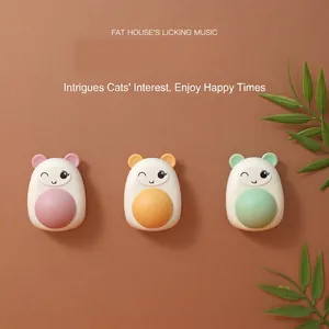 Set of three cute cartoon rotating catnip wall balls in pink orange and green for cats