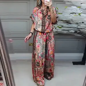 Bohemian floral print two-piece set with short sleeve top and wide-leg pants.
