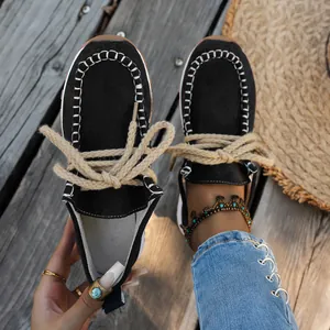 Casual black suede loafers with ethnic rope laces and white stitching detail