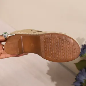 Macro view of the durable textured outsole and chunky heel of a retro mule sandal