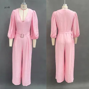 Front and back detail view of a pink deep V-neck puff sleeve wide-leg jumpsuit