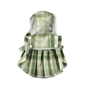 Detail view of green plaid pet JK school style dress with buttons and mesh lining