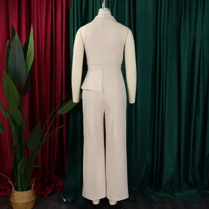 Back view of beige sleeveless wide leg jumpsuit with peplum waist detail