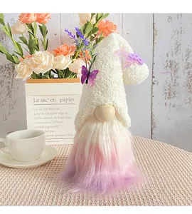 Plush holiday gnome with white fuzzy hat and purple gradient beard for desktop decoration