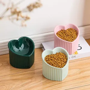 Heart-shaped ceramic elevated cat bowls with tilted ergonomic design for neck protection