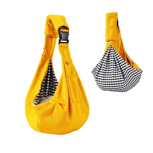 Adjustable yellow pet sling carrier with breathable checkered lining for dogs and cats