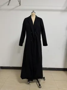 Elegant full-length black wool coat on mannequin featuring double-breasted lapel design