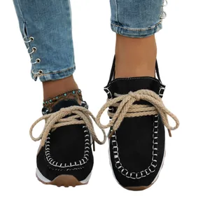 Women's black suede-like slip-on loafers with thick rope laces and soft gum sole.