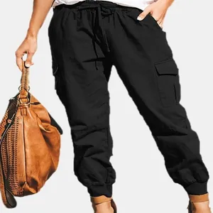 Detailed view of women's black cargo pants featuring side pockets and drawstring waist