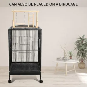 Wooden bird playground with swing and ladder placed on top of a large birdcage stand