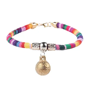 Colorful ethnic woven pet collar with a large vintage brass bell for cats and dogs