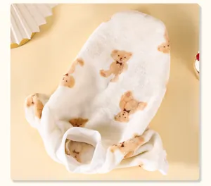 Close-up of soft flannel pet sweater featuring cute cartoon teddy bear pattern