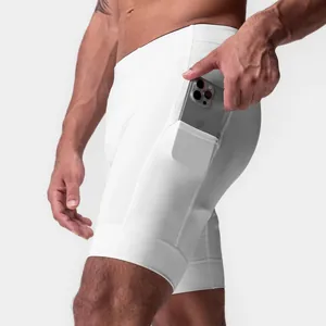 Close-up of white quick-dry compression shorts featuring a side phone pocket