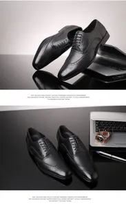 Close-up detail of black leather Brogue shoes with elegant office desk accessories