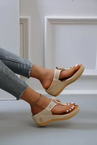 Stylish beige platform thong sandals featuring hollow straps and decorative B logo