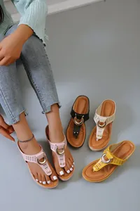 Detailed view of women's thick-sole flip-flop sandals with hollow T-strap and metal ring