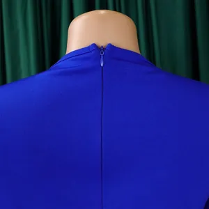Close-up of the invisible back zipper detail on a royal blue elegant office dress