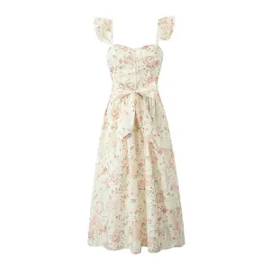 Detailed view of a floral print midi dress featuring a waist bow and ruffled straps
