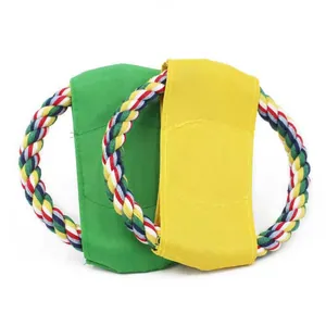 Detailed close-up of colorful canvas and rope flying disc dog toys for outdoor play