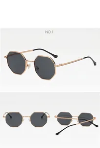 Detail view of retro octagonal gold metal sunglasses with dark lenses from multiple angles.
