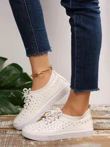 Stylish white breathable faux leather sneakers featuring hollow mesh design detail