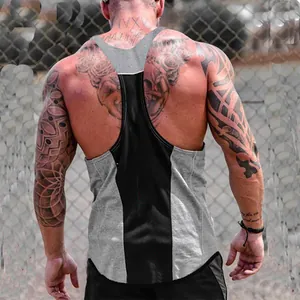 Rear view of a grey and black racerback tank top on a muscular tattooed athlete