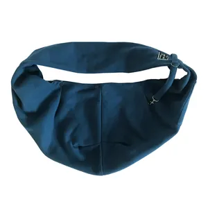 Navy blue breathable fabric pet sling carrier bag featuring a secure safety strap detail