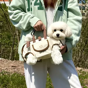 Portable pet carrier bag for small dogs and cats with breathable outdoor travel harness