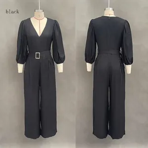 Front and back view of an elegant black deep V-neck jumpsuit with puff sleeves and belt