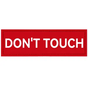 Detaillierte Ansicht des roten 'DON'T TOUCH' Stick-Klett-Patches für Hundegeschirre
