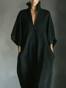 Elegant black V-neck maxi dress with loose half-sleeves and premium textured fabric finish