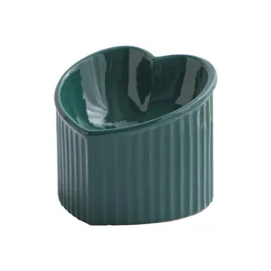 Premium dark green heart-shaped slanted ceramic elevated pet bowl for cats and dogs