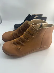 Retro flat ankle boots for women in brown and black with decorative cross lacing