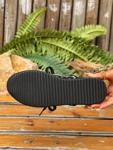 Detailed view showing the black corrugated anti-slip outsole of a casual women's platform shoe